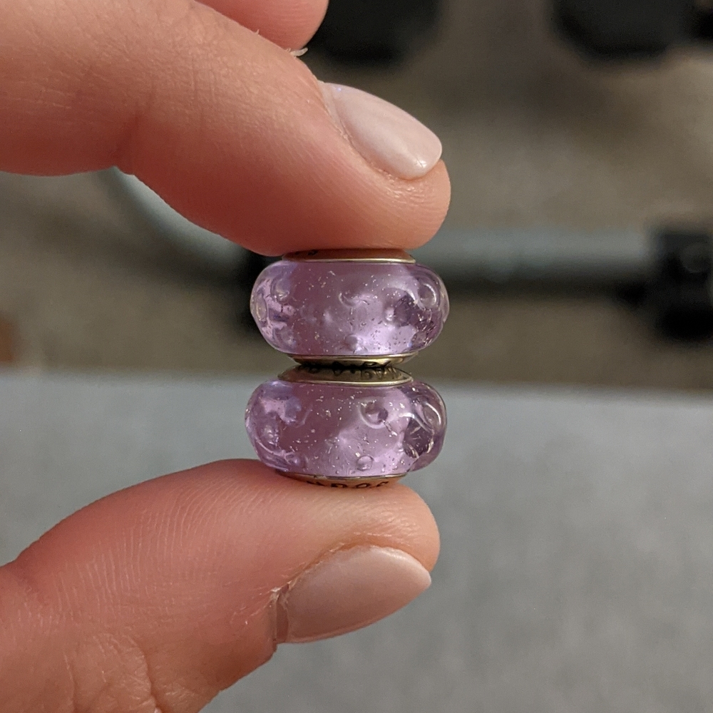 Two purple Murano glass charms